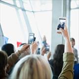 Woman taking photo with cellphone