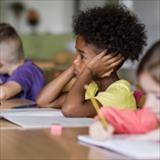 Elementary student looking anxious in the classroom