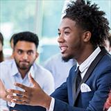 Young male student in classroom