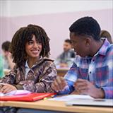 Young woman and man talking during class.