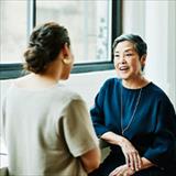 Doctor consulting with woman in office for healthcare