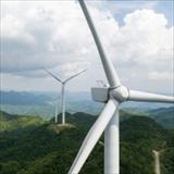 wind farm located on a mountain