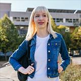 Transgender student standing on campus