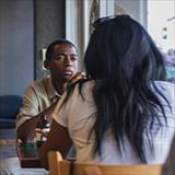 Two people at a table staring at each other
