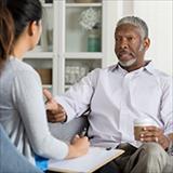 older adult talking to therapist