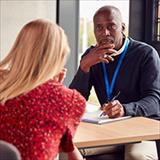 College student meets one-on-one with counselor.