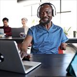 Happy disabled businessman talking to his colleague in the office