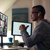 man in his home office attending a virtual meeting
