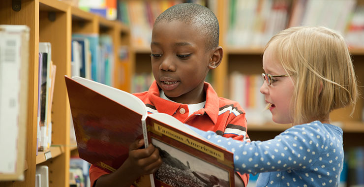 learning and memory research paper elementary school students looking at a book