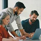 business people looking at laptop computer