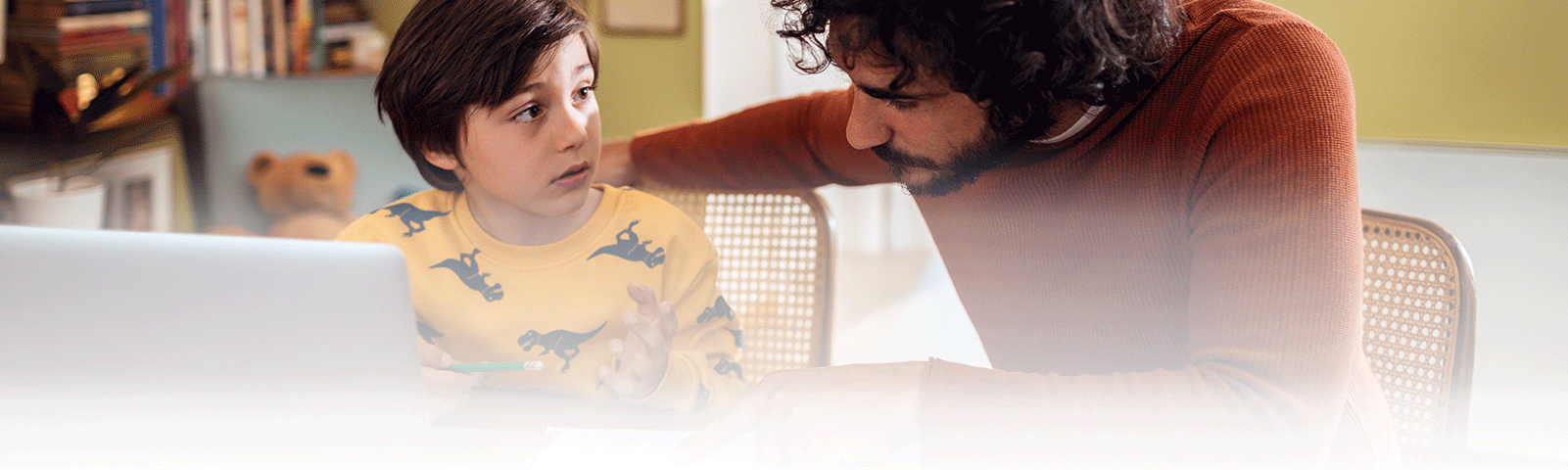 Father helping son with homework