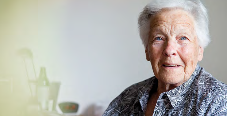 older woman with white hair smiling