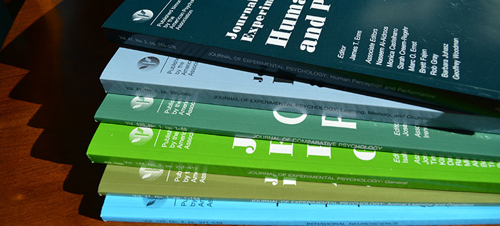 photo of stack of 6 APA journals that focus on experimental psychology