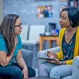 two women talking during a counseling session