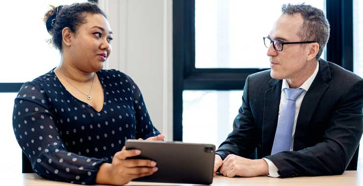 man and woman discussing professional ethics