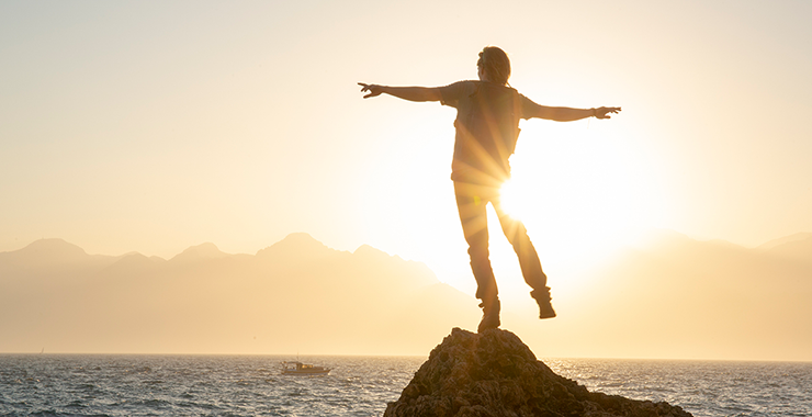 man standing enjoying sun
