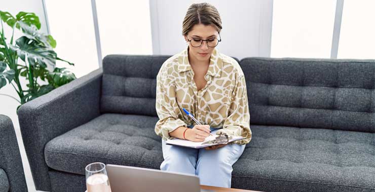 woman crossing items off checklist