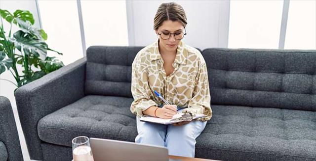woman crossing items off checklist