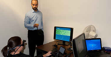 Dr. Robinson uses special equipment to track eye movements. 