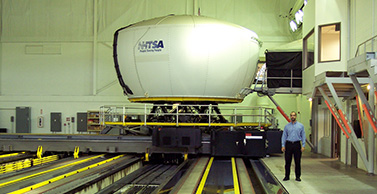 Dr. Robinson in the lab with one of the country's most advanced driving simulators.