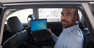 Dr. Robinson in the back seat of Westat's instrumented vehicle.