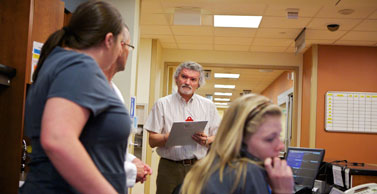 Dr. Salas observes nurses working in an emergency room.
