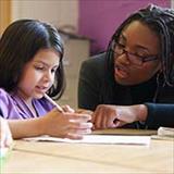 teacher and student in classroom