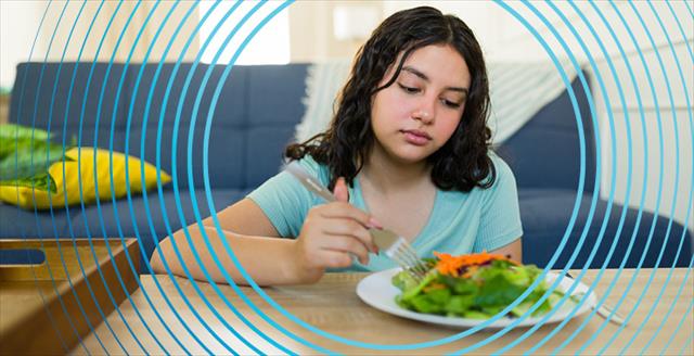 young woman not interested in eating her meal