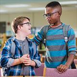 Young students hugging each other.