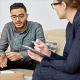 young man discussing issues with a therapist