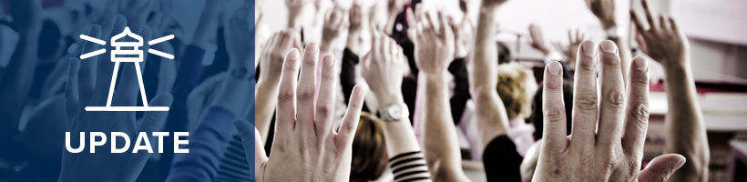 Strategic plan update, group of people raising hands