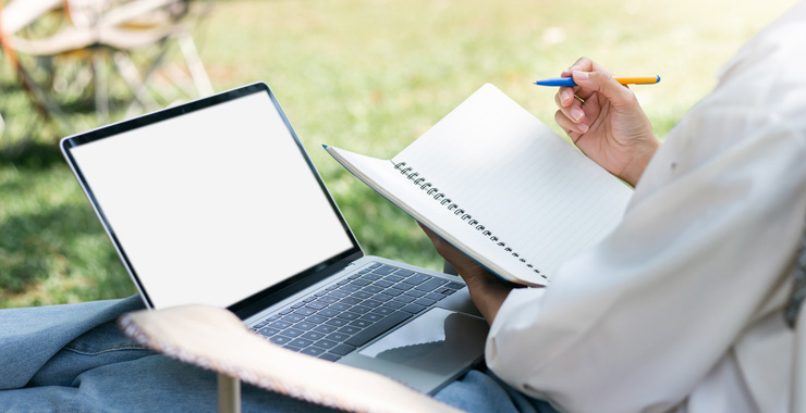 person working on a laptop outside