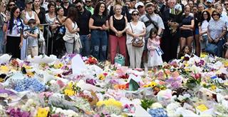 people gathered at memorial for victims of Bondi Beach antisemitic attack