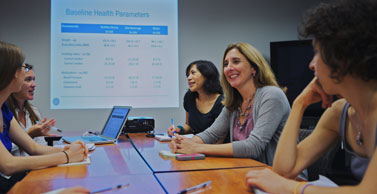 Dr. Tate meets with her research team.