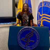 Dr. Thema speaking on maternal mental health at the U.S. Department of Health and Human Services