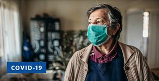 older man wearing a medical mask