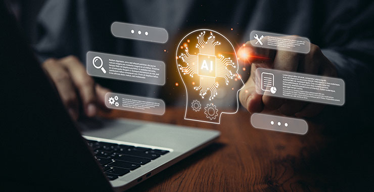 Man typing on laptop; image overlayed with outline of human from neck up that contains the AI acronym and is surrounded by thought bubbles.