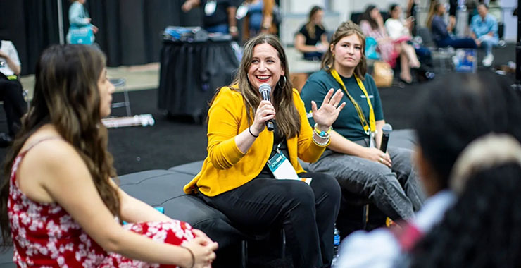 Woman speaks to students attending APA 2026