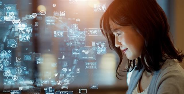 Asian woman watching hologram screens