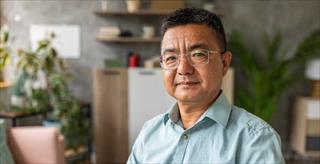 Portrait of a mature Chinese man at home