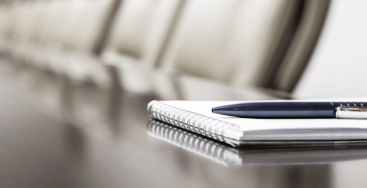 Image of spiral notebook and pen