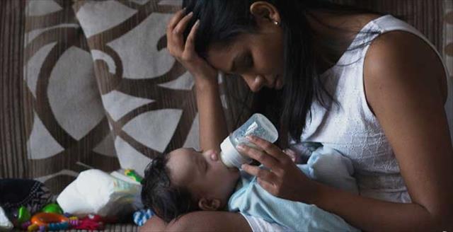 Mother feeding baby