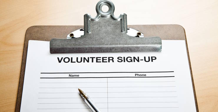 A volunteer sign-up sheet attached to a clipboard.
