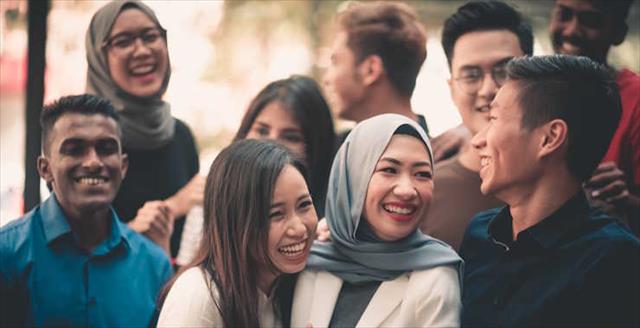 A group of young and diverse adults gathering 