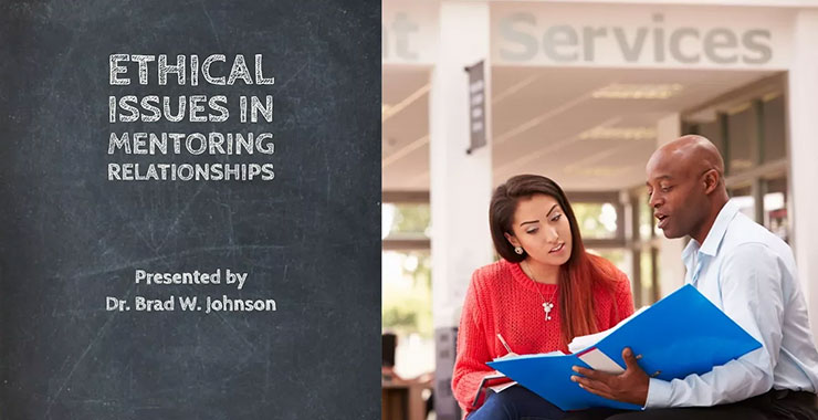 Two colleagues discuss project while reviewing notes in blue binder.