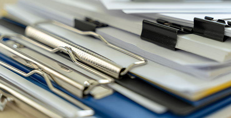 Stack of clipboards.
