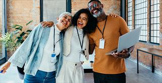 Happy co-workers smiling together.