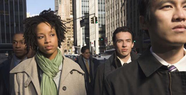 Multi-ethnic businesspeople in urban scene