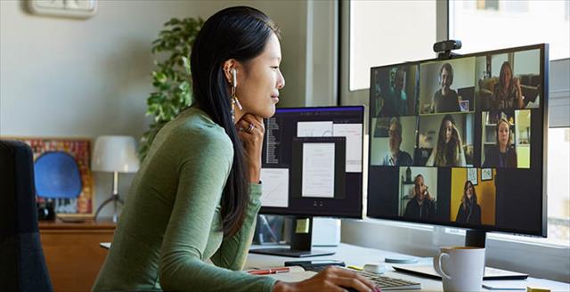 Woman smiling and using a computer