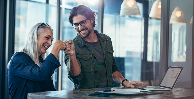 Woman and man doing a fist bump.